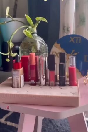 Cosmetic Lipsticks Display on Pink Stool